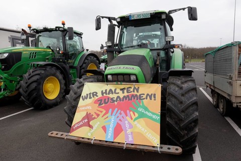 We stick together, sign on a tractor, farmers' protests, demonstration against policies of the