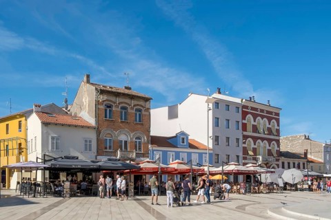 Cafe and restaurant in the old town centre of Porec, Istria, Croatia, Europe