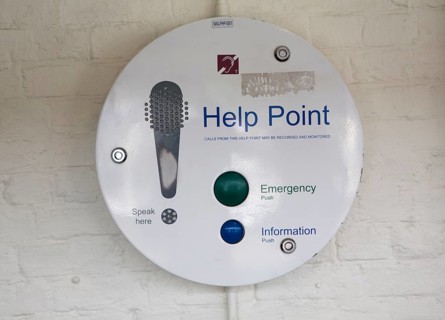 Emergency and information help point telephone intercom on railway station London, UK