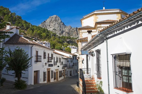 Limestone mountain peaks tower over the Village of Grazalema, Cadiz province, Spain, Europe