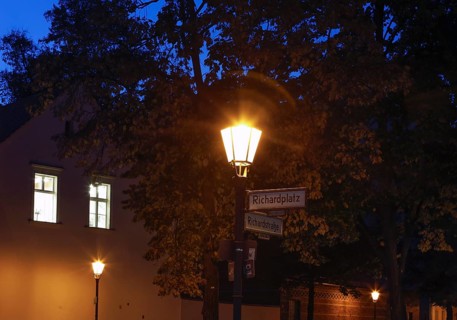 Old lanterns illuminate Richardplatz in Berlin's Neukoelln district. Richardplatz is the central