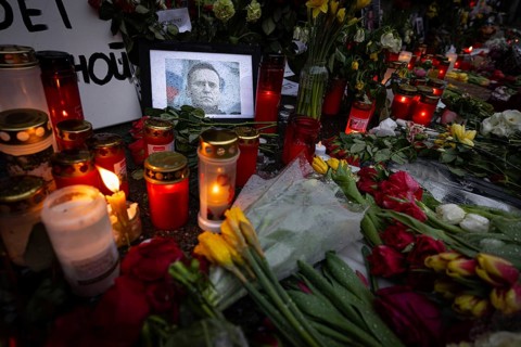 Photos, candles, grave lights and flowers for the Russian opposition leader Alexei Navalny, who