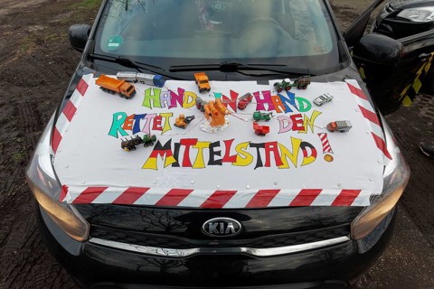 Placard with the theme Mittelstand on a car, farmers' protests, demonstration against the policy of