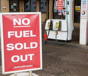 No Fuel Sold Out sign on petrol pumps in John Grose garage, Melton, Suffolk, England, United