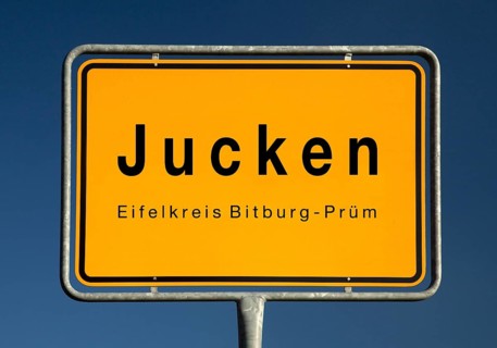 Place name sign Jucken, municipality in the Eifel district of Bitburg-Pruem, Rhineland-Palatinate,