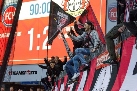 Football match, Bayer Leverkusen fans celebrate the victory of their team in Heidenheim together