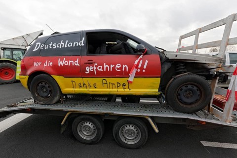 Accident car painted in Germany colours, with the inscription Deutschland vor den Wand gefahren,