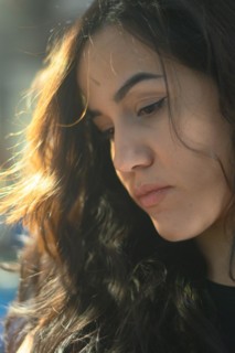 A contemplative woman bathed in soft natural light, exuding a gentle mood, a complete tool panel in