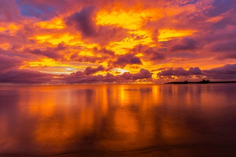 Beautiful sunset over ocean water taken from a beach in Guam
