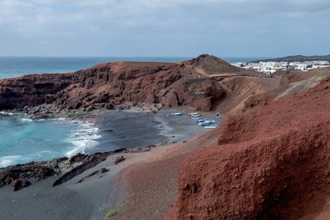 Fishing boats on the black beach of El Golfo, volcanic crater, Lanzarote, Canary Islands, Spain,