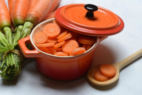 Sliced carrots in pot and bunch Carrots, Daucus carota, carrots