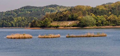 Landscape of lake with three small islands in the middle of lake in South Korea