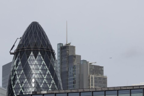 The Gherkin skyscraper building and nearby high rise office building, City of London, England,