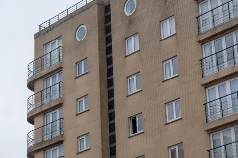 A section of a cream-coloured residential building with balconies, Blankenberge, Flanders, Belgium,