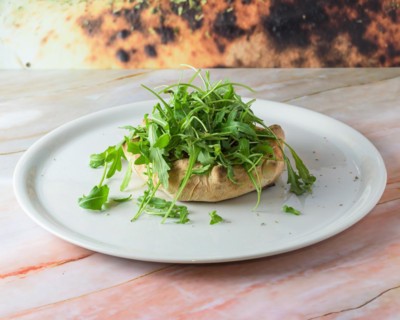 Fugazzeta Argentinian Stuffed Pizza is filled with a layer of mozzarella cheese with sliced onions