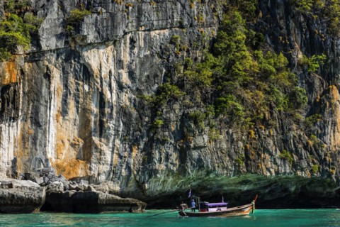 Fisherman on a longtail boat at Maya Bay, boat, wooden boat, local, tradition, Thai, Asian,