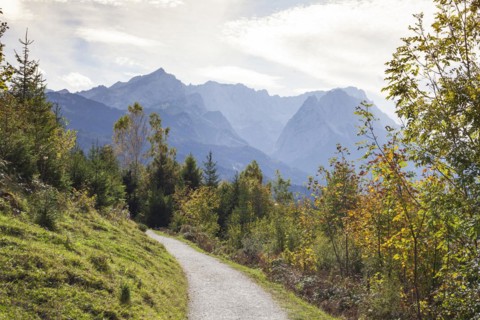 Wetterstein mountains with Alpspitze, Zugspitze massif and houses with hiking trail Philosophenweg,