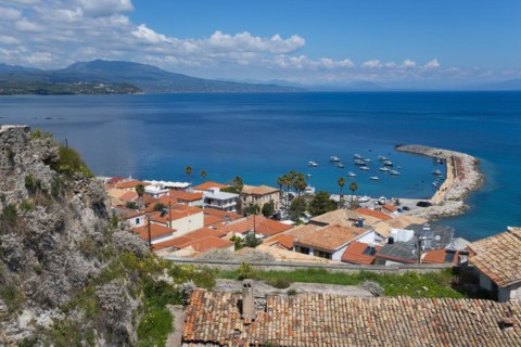 View of a Mediterranean coastal town with a harbour and boats on the sea, old town, Koroni,