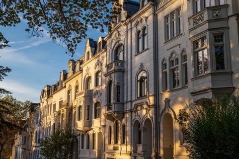 The sun illuminates old building facades in the morning light, Wilhelminian style, Briller Viertel,