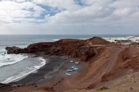 Fishing boats on the black beach of El Golfo, volcanic crater, Lanzarote, Canary Islands, Spain,