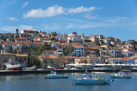 A picturesque coastal town on a sunny day with boats in the water, Koroni, Pylos-Nestor, Messinia,