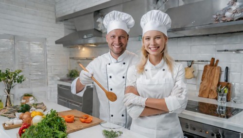 AI generated, Two attractive chefs in the kitchen of a hotel, man and woman