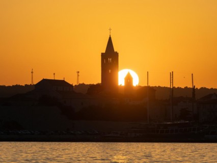 Sunset, silhouette of the church towers of Rab, town of Rab, island of Rab, Kvarner Gulf Bay,