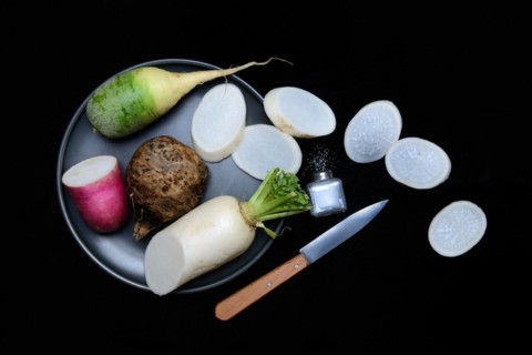 Various radishes on a plate, sliced, Raphanus
