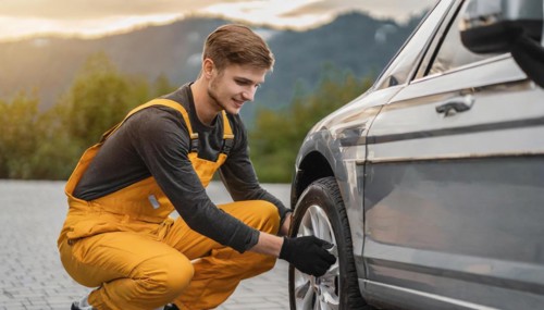 AI generated, A mechanic changes the tyres on a customer's car, tyre fitting, silver car
