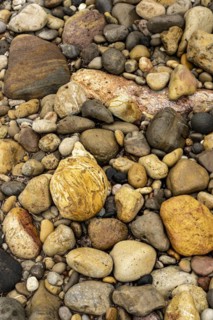 Colourful stones on the beach of Malolo, Milos, Cyclades, Greece, Europe