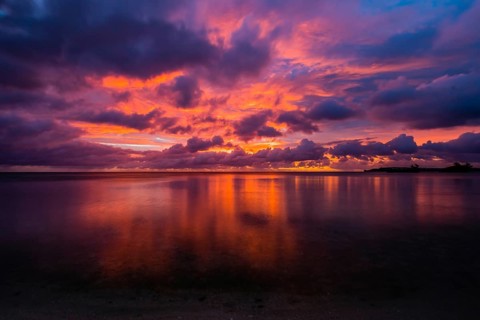 Beautiful sunset over ocean water taken from a beach in Guam