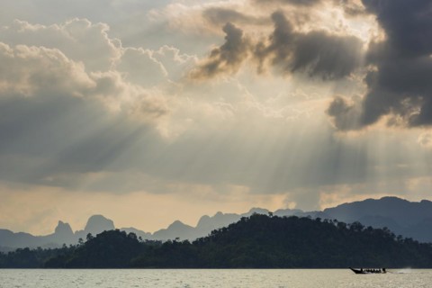 Limestone rocks in the evening light in Cheow Lan Lake in Khao Sok National Park, evening, sunset,