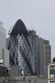 The Gherkin skyscraper building and nearby high rise office building, City of London, England,