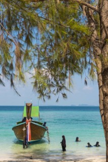 Muslim woman bathing on the beach, longtail boat, wooden boat, boat, decorated, tradition,