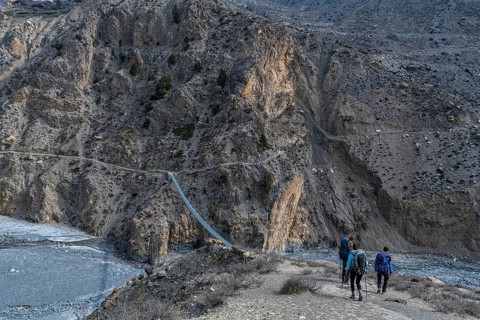 Tourists hiking a huge hanging bridge, Kingdom of Mustang, Nepal, Asia