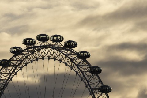 London Eye or Millennium Wheel tourist observation wheel close up of pods at sunset, City of