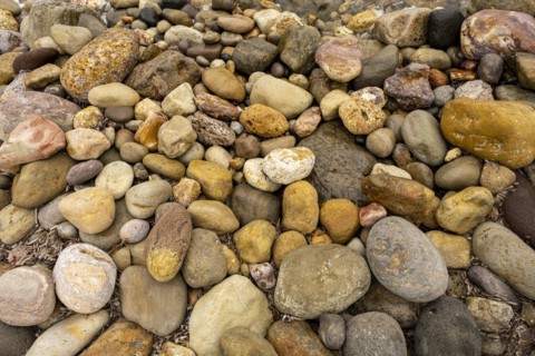 Colourful stones on the beach of Malolo, Milos, Cyclades, Greece, Europe