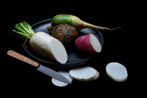Various radishes on a plate, sliced, Raphanus