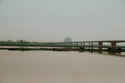 Cinematic dark and moody scenery of a bridge over the river in Ninh Binh, Vietnam, Asia