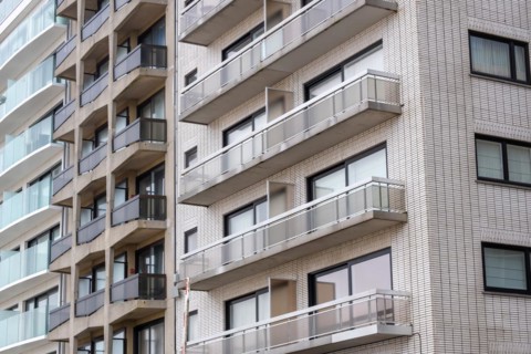A section of a residential building with many balconies and a brick facade, Blankenberge, Flanders,