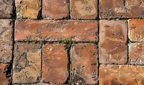 Terracotta paving stones form a textured ground surface with a classic weathered brick pattern AI