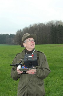 Hunter observes and controls flying drone during a hare (Lepus europaeus) census, Lower Austria,