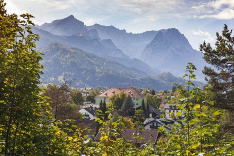 Wetterstein mountains with Alpspitze, Zugspitze massif and houses in the Partenkirchen district