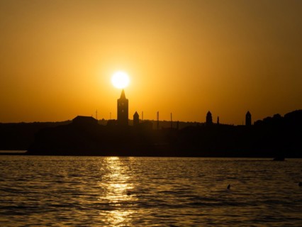 Sunset, silhouette of the church towers of Rab, town of Rab, island of Rab, Kvarner Gulf Bay,