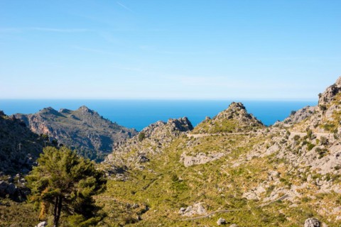 Mountain landscape with winding mountain road from Sa Calobra to Torrent de Pareis, steep, partly
