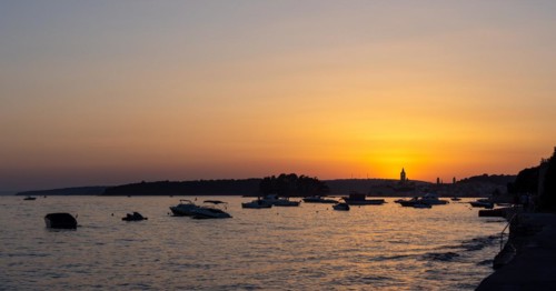 Sunset, boats anchoring in a bay near Rab, panoramic view, town of Rab, island of Rab, Kvarner Gulf