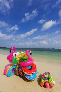Sale of inflatable swimming aids, colourful, swimming, beach vendor, holiday, symbol, symbolic,