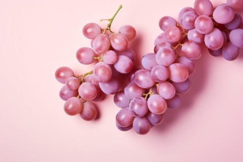 Top view of grape fruits on pastel pink background. KI generiert, generiert AI generated