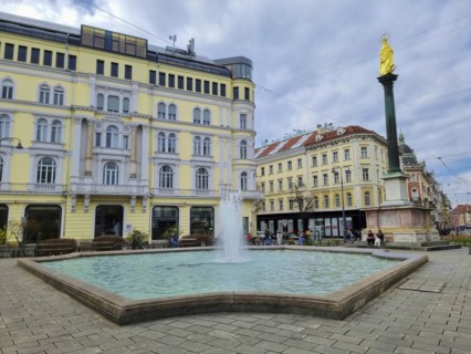 Graz, Austria, 26.03.2023: Mary's Column and fountain in Jakominiplatz Square, famous attraction in