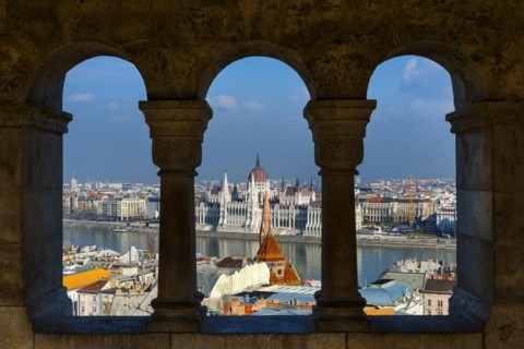 View through the facade of the Fisherman's Bastion to the Danube and the Parliament, politics, city
